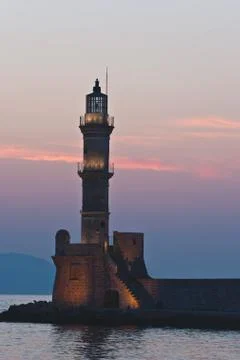 Chania lighthouse at sunset. Stock Photos
