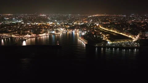Chania town by night, Lighthouse, Drone shot, Crete, Greece, Aerial view of Chan Stock Footage 297371889