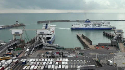 A Channel Ferry Sails Into Dover Port As Vehicles Exit A Moored Ferry Stock Footage 346752834