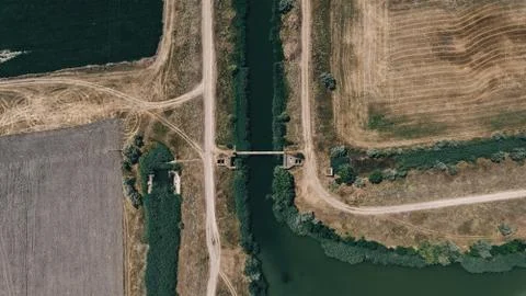 Channel in the middle of the fields Stock Photos