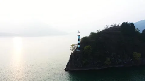 Channel Navigation Lighthouse on River Islet 4K Aerial Sunset Stock Footage 321040705