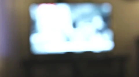 Channel surfing with a TV remote Stock Footage 52343770