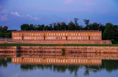 Chantilly castle panoramic view on sunset background Stock Photos