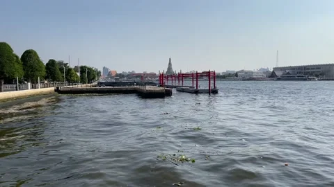 Chao Phraya River landscape view, blue sky with Wat Arun (Temple of Dawn) Stock Footage 224309888