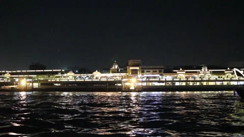 Chao Phraya River NIght View thought River Rice Barge Passing and cruising along Stock Footage 130366491