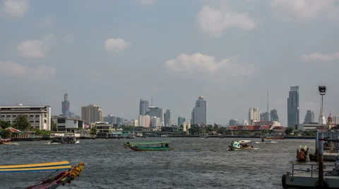 Chao Phraya river with skyline, small boats and cloudy sky DSLR timelapse Stock Footage 49842770