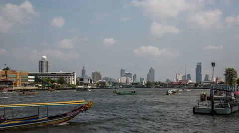 Chao Phraya river with skyline, small boats and cloudy sky, by day timelapse Stock-Footage 49845854