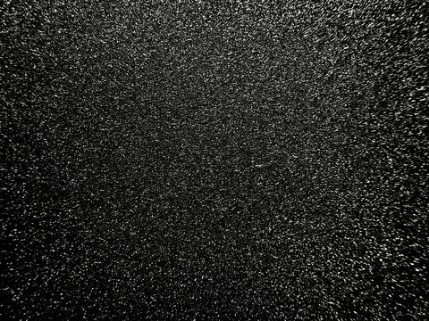 Chaotic black and white static noise with radial blur creating an abstract gr Stock Photos