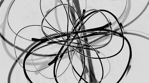 Chaotic black wires tangled mess on white background Stock Footage 333500993