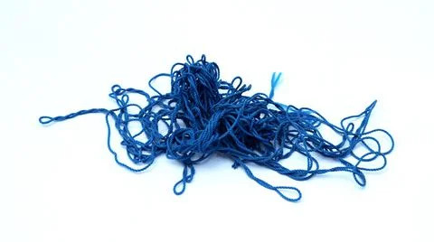 Chaotic blue threads into an irregular circle on a white background Stock Photos