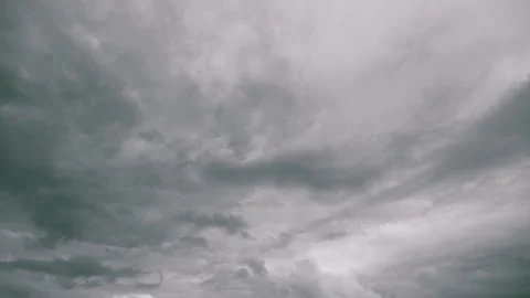 Chaotic clouds foretell approaching tempest, Tempest clouds swirl in turbulent s Stock Footage 325639726