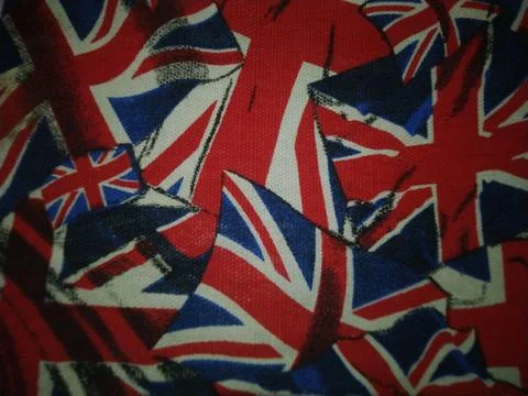 A chaotic collage of Union Jack flags, representing British identity  Stock Photos