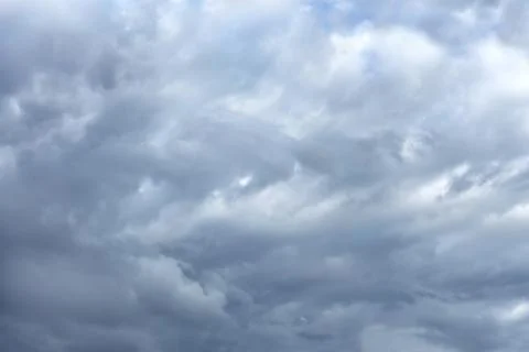 Chaotic gray clouds in windy weather Stock Photos