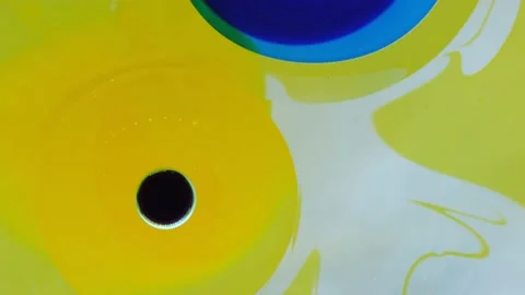 Chaotic movement, expansion of the bubble flow, swirls of yellow, blue and white Stock Footage 187734636