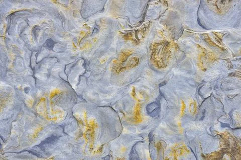 Chaotic pattern of rough stone surface as background Stock Photos