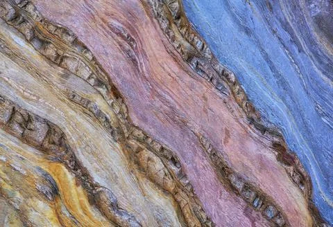 Chaotic pattern of rough stone surface as background Stock Photos