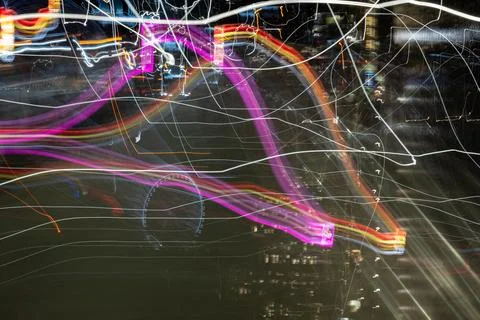 Chaotic patterns shapes and reflections of urban night lights shot using in.. Stock Photos