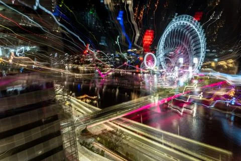Chaotic patterns shapes and reflections of urban night lights shot using in.. Stock Photos