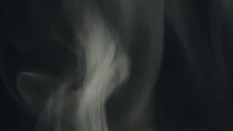 Chaotic smoke on black background. Cloud of cold fog on black background. Stock Footage 162768398