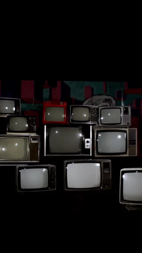 Chaotic Stack of Vintage TVs in a Dark Room - Vertical 4K 스톡 동영상 292852914