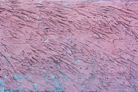A chaotic striped pattern with recesses in the mortar. It is covered with pin Stock Photos
