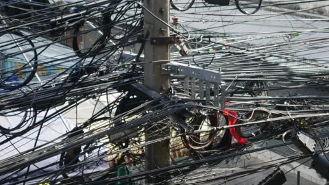 Chaotic tangle of electrical and fiber optic cables Stock Footage 334413170