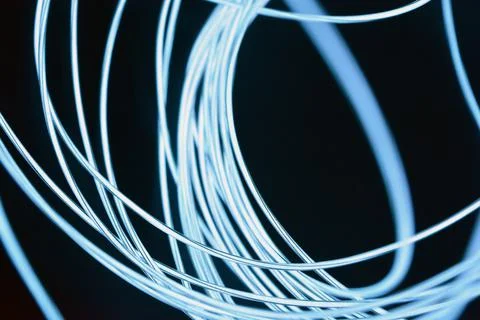 Chaotically celestial, light blue, neon harness, illuminated wire, thin wire. Fotos de archivo
