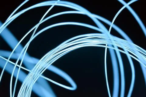 Chaotically celestial, light blue, neon harness, illuminated wire, thin wire. Fotos de archivo