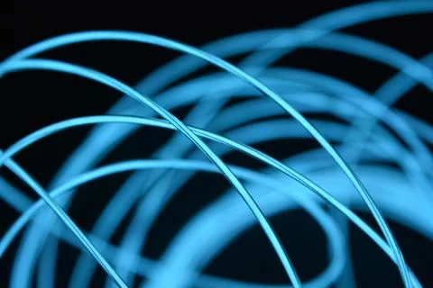 Chaotically celestial, light blue, neon harness, illuminated wire, thin wire. Fotos de archivo