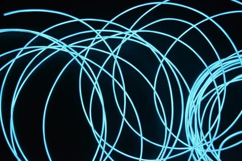 Chaotically celestial, light blue, neon harness, illuminated wire, thin wire. Fotos de archivo