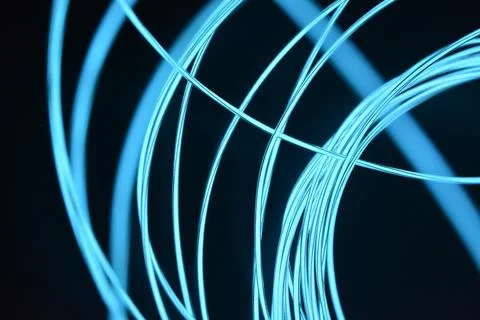 Chaotically celestial, light blue, neon harness, illuminated wire, thin wire. Fotos de archivo
