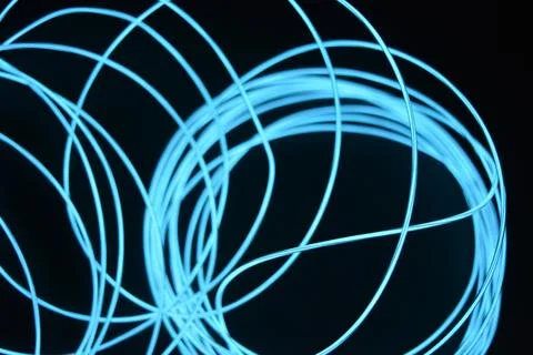 Chaotically celestial, light blue, neon harness, illuminated wire, thin wire. Fotos de archivo