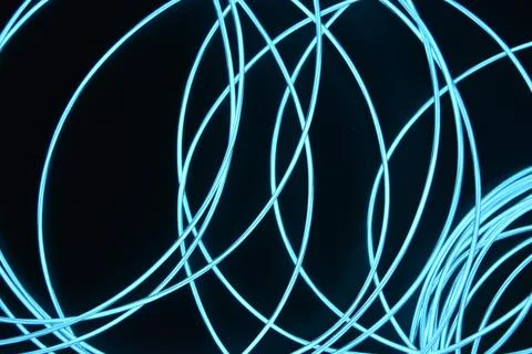 Chaotically celestial, light blue, neon harness, illuminated wire, thin wire. Fotos de archivo
