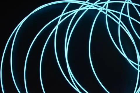 Chaotically celestial, light blue, neon harness, illuminated wire, thin wire. Fotos de archivo