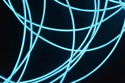 Chaotically celestial, light blue, neon harness, illuminated wire, thin wire. Fotos de archivo