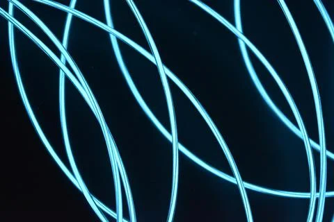 Chaotically celestial, light blue, neon harness, illuminated wire, thin wire. Fotos de archivo