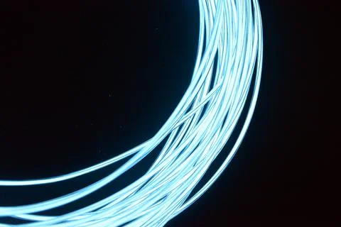 Chaotically celestial, light blue, neon harness, illuminated wire, thin wire. Fotos de archivo