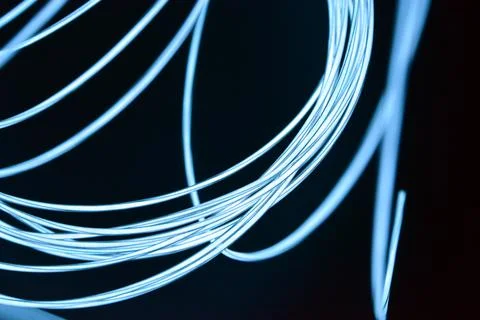 Chaotically celestial, light blue, neon harness, illuminated wire, thin wire. Fotos de archivo