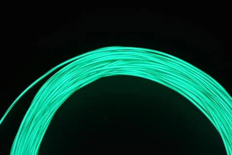Chaotically celestial, light blue, neon harness, illuminated wire, thin wire. Fotos de archivo