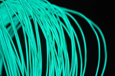 Chaotically celestial, light blue, neon harness, illuminated wire, thin wire. Stock Photos