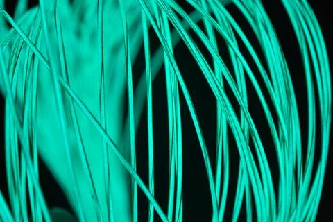 Chaotically celestial, light blue, neon harness, illuminated wire, thin wire. Fotos de archivo