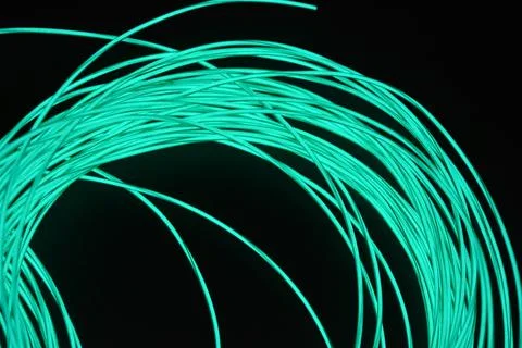 Chaotically celestial, light blue, neon harness, illuminated wire, thin wire. Fotos de archivo