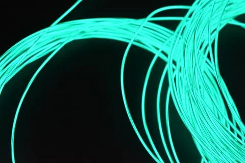 Chaotically celestial, light blue, neon harness, illuminated wire, thin wire. Fotos de archivo