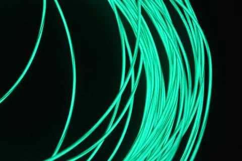 Chaotically celestial, light blue, neon harness, illuminated wire, thin wire. Fotos de archivo