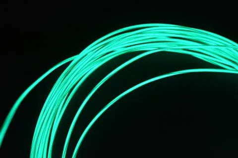 Chaotically celestial, light blue, neon harness, illuminated wire, thin wire. Stock Photos