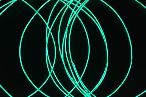 Chaotically celestial, light blue, neon harness, illuminated wire, thin wire. Fotos de archivo