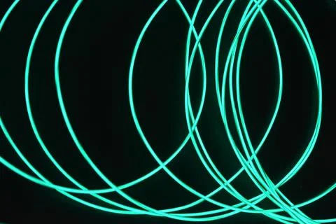 Chaotically celestial, light blue, neon harness, illuminated wire, thin wire. Fotos de archivo