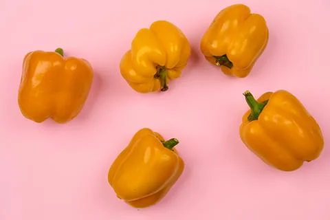 Chaotically lying peppers on a light background Stock Photos