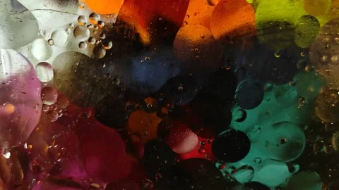 Chaotically moving multicolored bubbles in a viscous liquid substance. Stock-Footage 146230633
