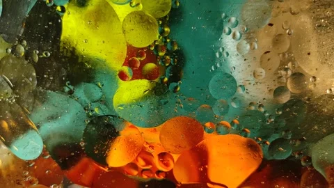 Chaotically moving multicolored bubbles in a viscous liquid substance. Stock-Footage 147249447